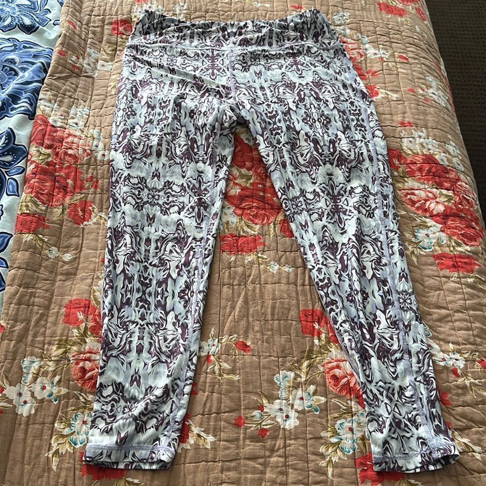 Sweaty Betty “the Contour” yoga pants. Purple and blue marbling design pattern.